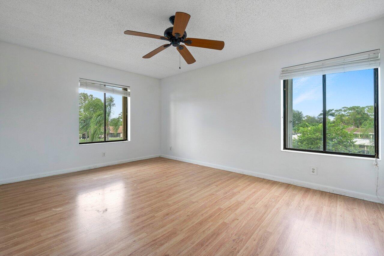 603 Sea Pine Way, Unit E3 Greenacres, FL 33415 - Photo 8 of 22 a view of a hardwood floor in a room