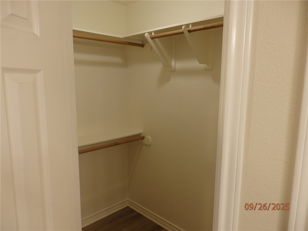 3717 Dove Crossing Lane College Station, TX 77845 - Photo 14 of 27 Walk in closet with dark wood-type flooring