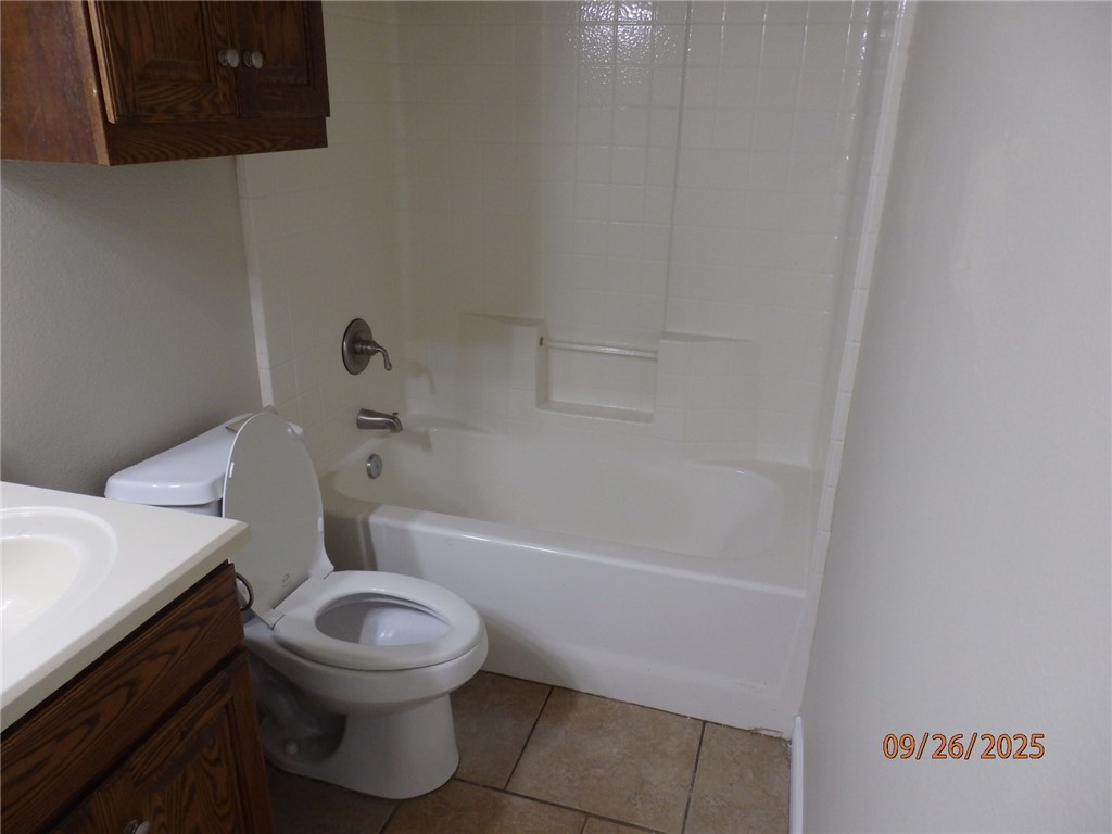3717 Dove Crossing Lane College Station, TX 77845 - Photo 18 of 27 Full bath featuring shower / bathtub combination, vanity, and light tile patterned flooring