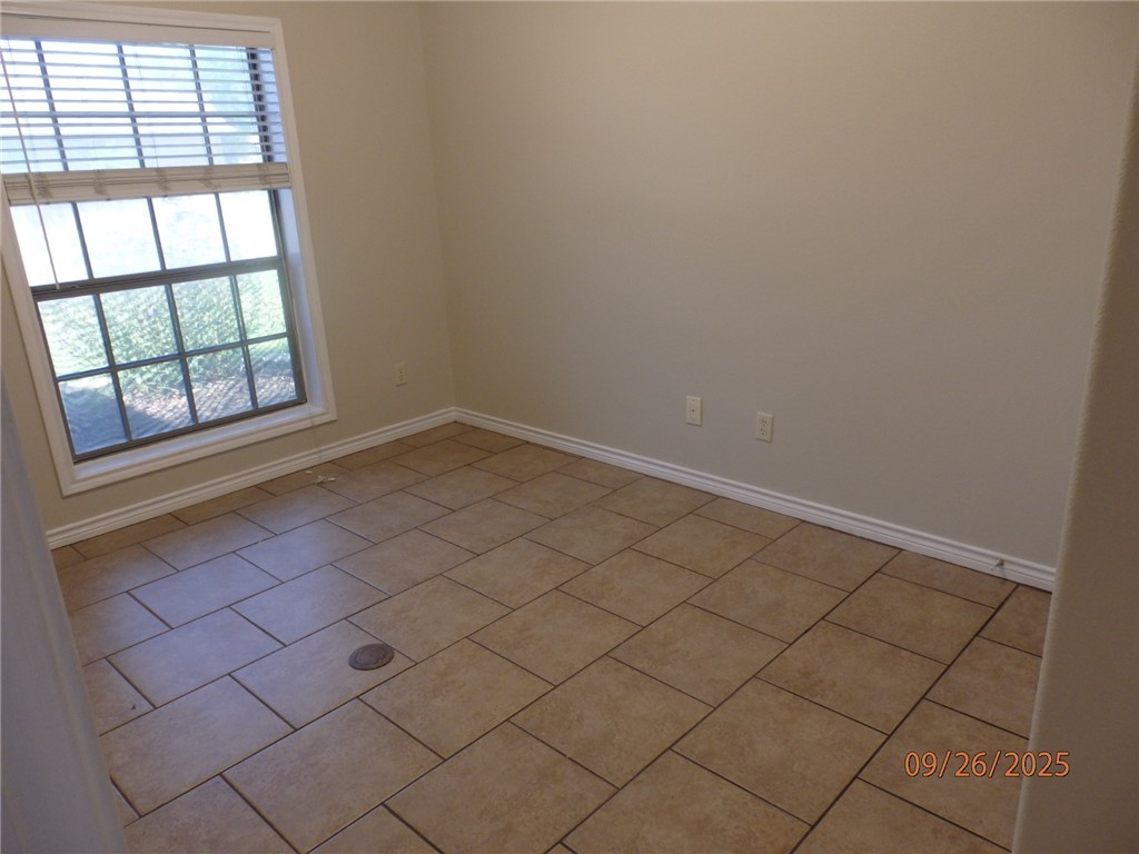 3717 Dove Crossing Lane College Station, TX 77845 - Photo 19 of 27 Empty room with light tile patterned floors and baseboards