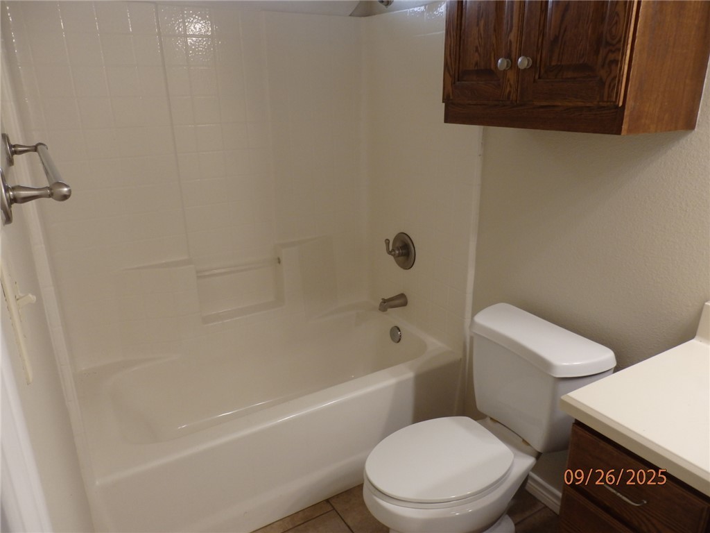 3717 Dove Crossing Lane College Station, TX 77845 - Photo 21 of 27 Full bathroom featuring vanity, tile patterned floors, and washtub / shower combination