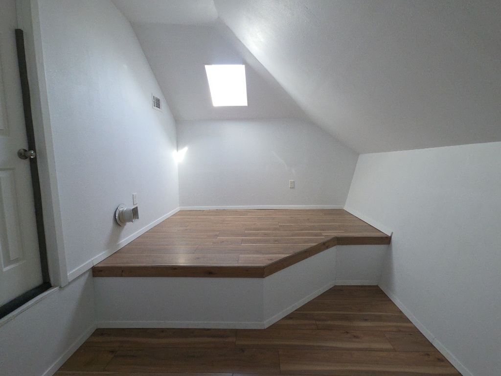 13208 Mariscan Street Manchaca, TX 78652 - Photo 23 of 31 Bonus room featuring dark wood finished floors and lofted ceiling