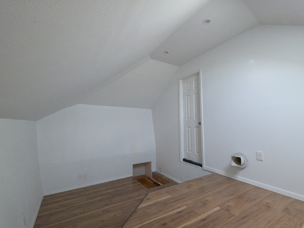 13208 Mariscan Street Manchaca, TX 78652 - Photo 25 of 31 Additional living space with lofted ceiling and wood finished floors