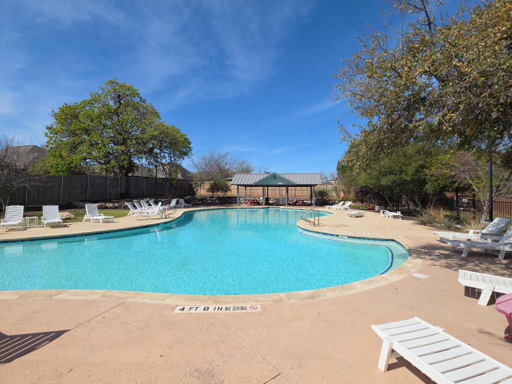 13208 Mariscan Street Manchaca, TX 78652 - Photo 27 of 31 Community pool with a patio