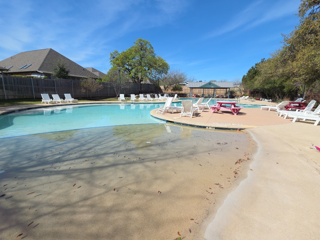 13208 Mariscan Street Manchaca, TX 78652 - Photo 28 of 31 Community pool with a patio area