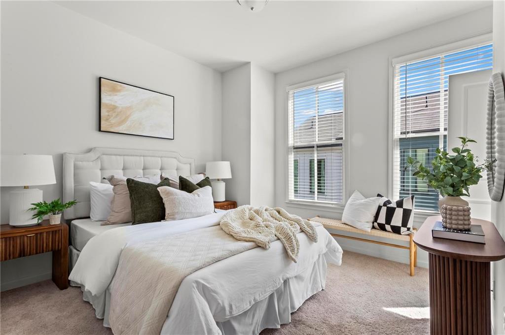 718 Needletail Way Atlanta, GA 30312 - Photo 25 of 44 a bedroom with bed and a large window