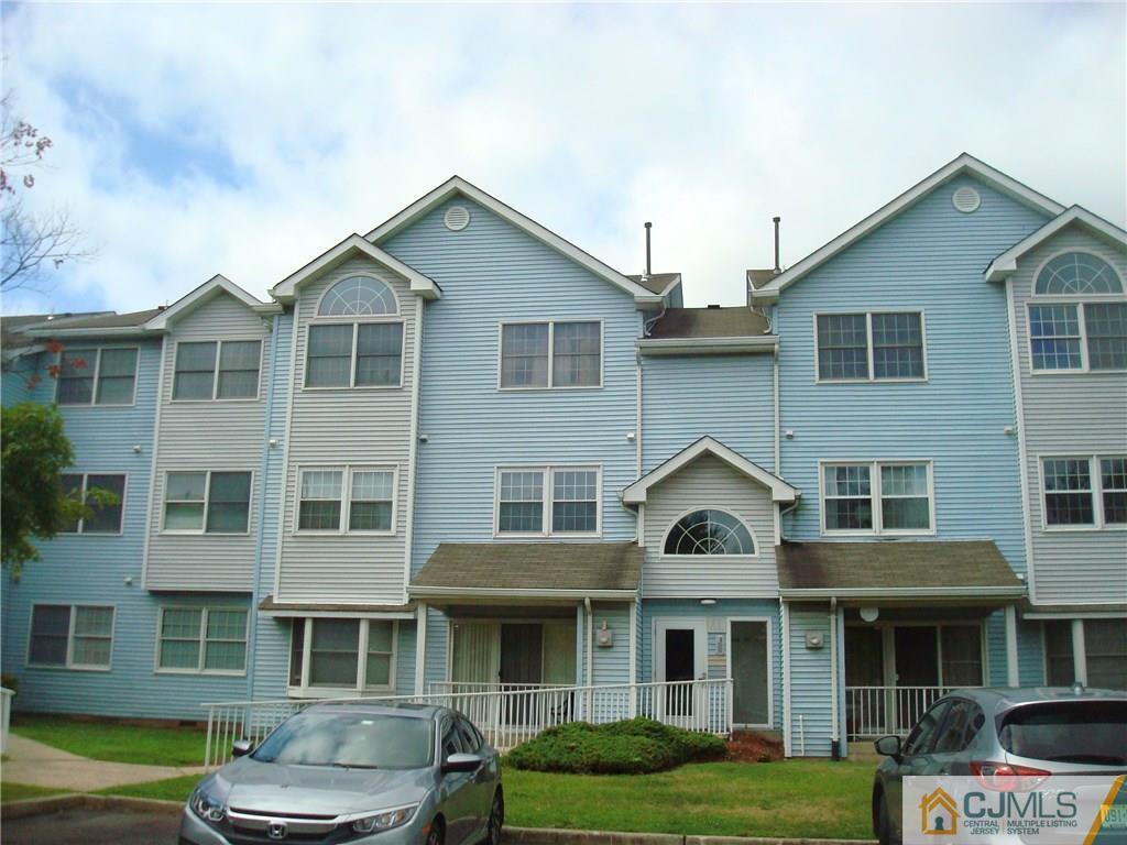 317 Edpas Road, Unit 317 New Brunswick, NJ 08901 - Photo 1 of 9 a front view of a house with a garden