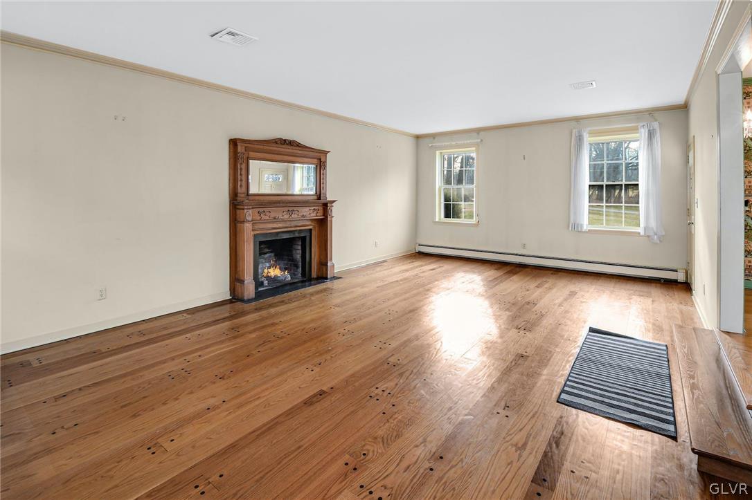 1655 White Acre Drive Bethlehem, PA 18015 - Photo 15 of 39 an empty room with wooden floor fireplace and windows