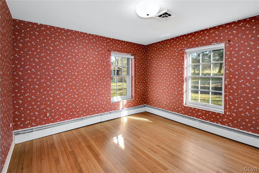 1655 White Acre Drive Bethlehem, PA 18015 - Photo 18 of 39 a view of an empty room with a window and wooden floor