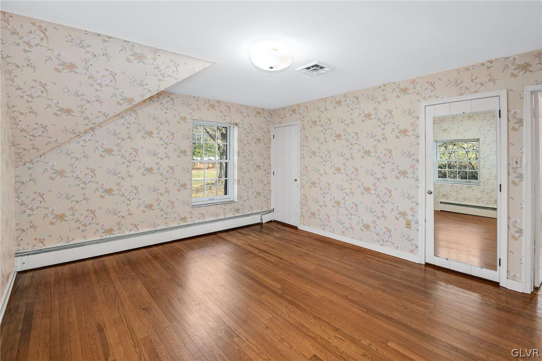 1655 White Acre Drive Bethlehem, PA 18015 - Photo 19 of 39 an empty room with wooden floor and windows