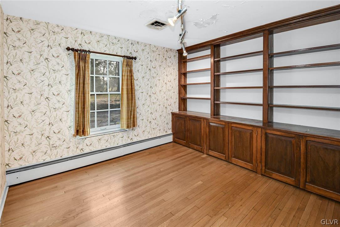 1655 White Acre Drive Bethlehem, PA 18015 - Photo 21 of 39 a view of an empty room with wooden floor and a window