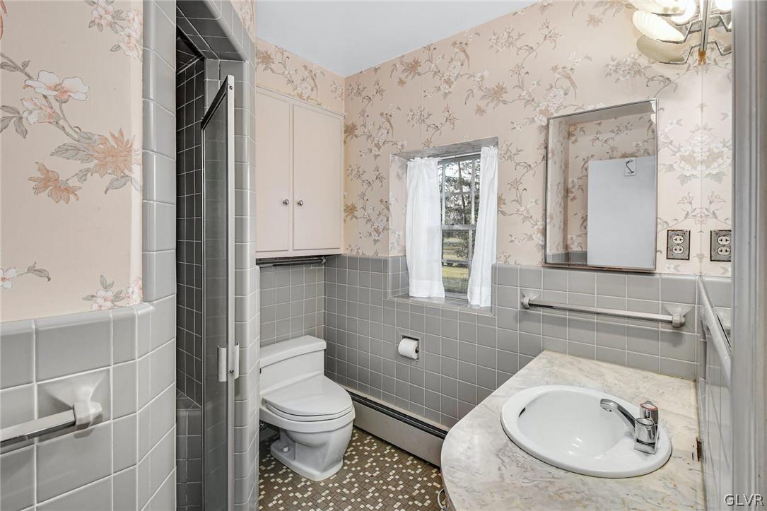 1655 White Acre Drive Bethlehem, PA 18015 - Photo 22 of 39 a bathroom with a granite countertop toilet sink and mirror