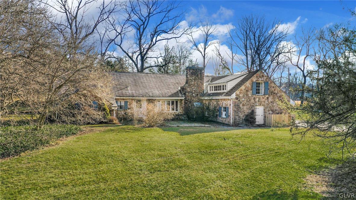 1655 White Acre Drive Bethlehem, PA 18015 - Photo 3 of 39 a view of a large house with a big yard and large tree
