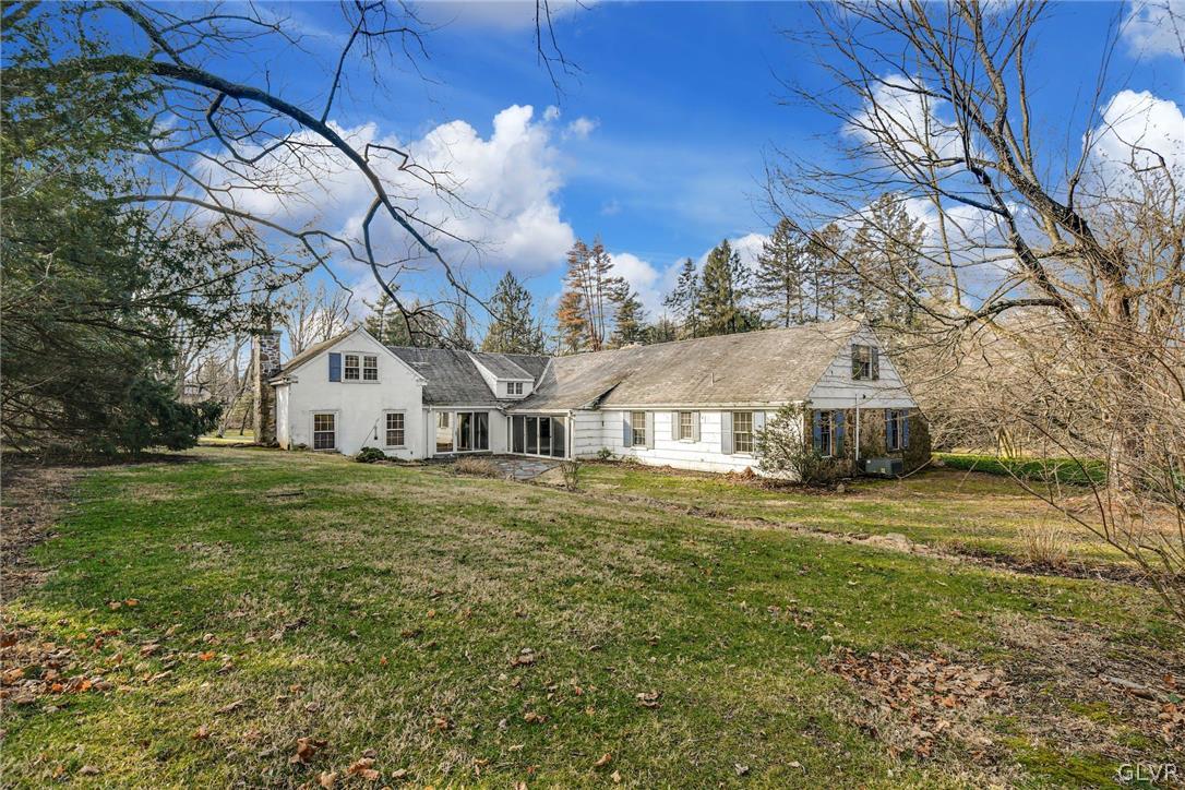 1655 White Acre Drive Bethlehem, PA 18015 - Photo 5 of 39 a view of a big house with a big yard and large tree