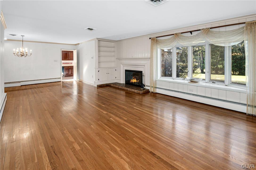 1655 White Acre Drive Bethlehem, PA 18015 - Photo 7 of 39 a view of a room with wooden floor and a fireplace