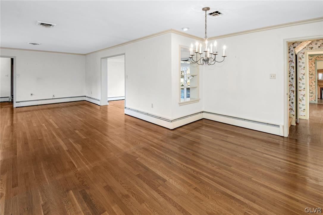 1655 White Acre Drive Bethlehem, PA 18015 - Photo 9 of 39 a view of a room with wooden floor and chandelier