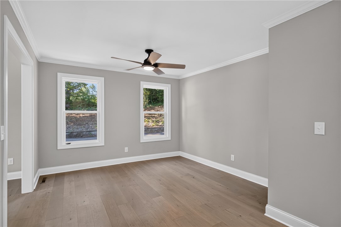 712 Beech Drive Seneca, SC 29678 - Photo 16 of 41 Hardwood floors and generous natural light create an inviting atmosphere in this flexible room.