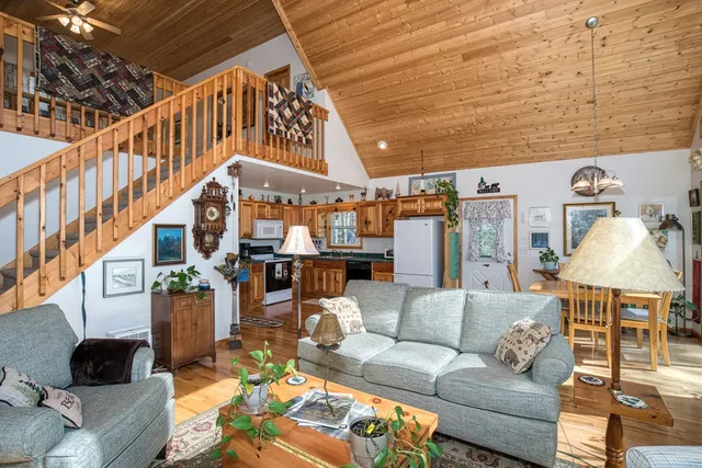 a bedroom with furniture and flat screen tv