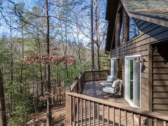 a view of a bench with chairs and a table