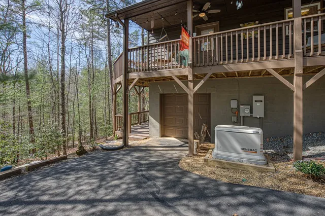 a view of balcony with wooden floor and fence