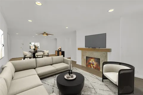 a living room with furniture fireplace and a fireplace