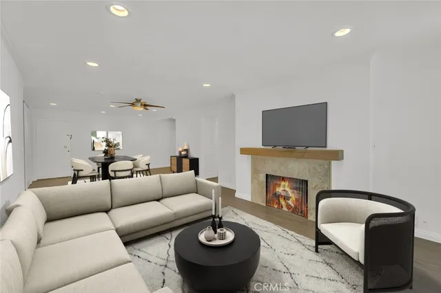 a living room with furniture fireplace and a fireplace