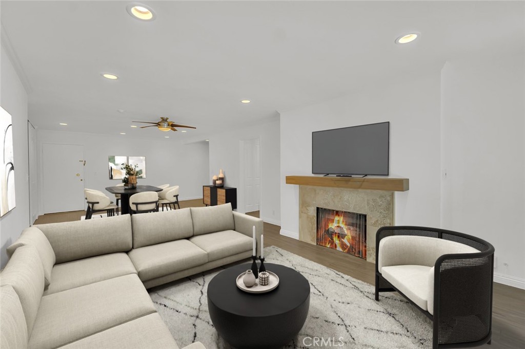 a living room with furniture fireplace and a fireplace