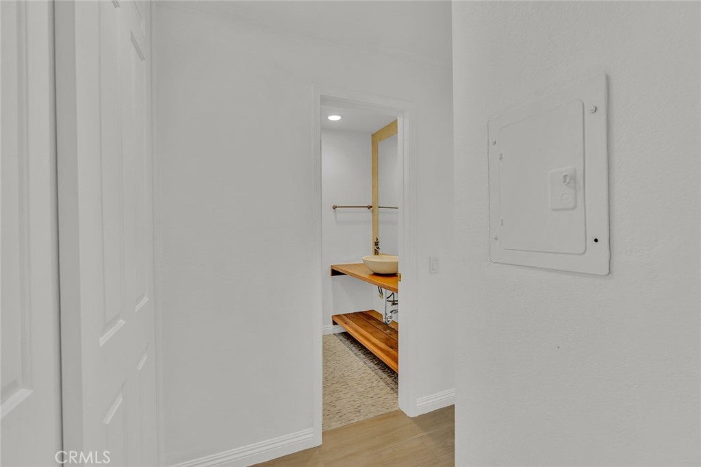 200 McNeil Lane, Unit 204 Newport Beach, CA 92663 - Photo 12 of 28 a view of staircase with white walls