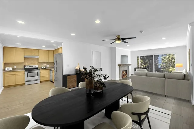 a living room with furniture kitchen and a table