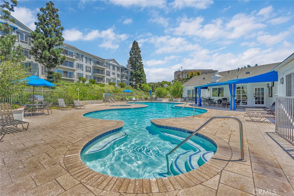 200 McNeil Lane, Unit 204 Newport Beach, CA 92663 - Photo 27 of 28 a view of a house with swimming pool and sitting area
