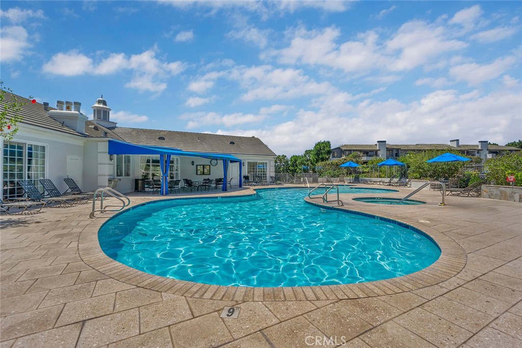 200 McNeil Lane, Unit 204 Newport Beach, CA 92663 - Photo 28 of 28 a view of a swimming pool with an outdoor seating