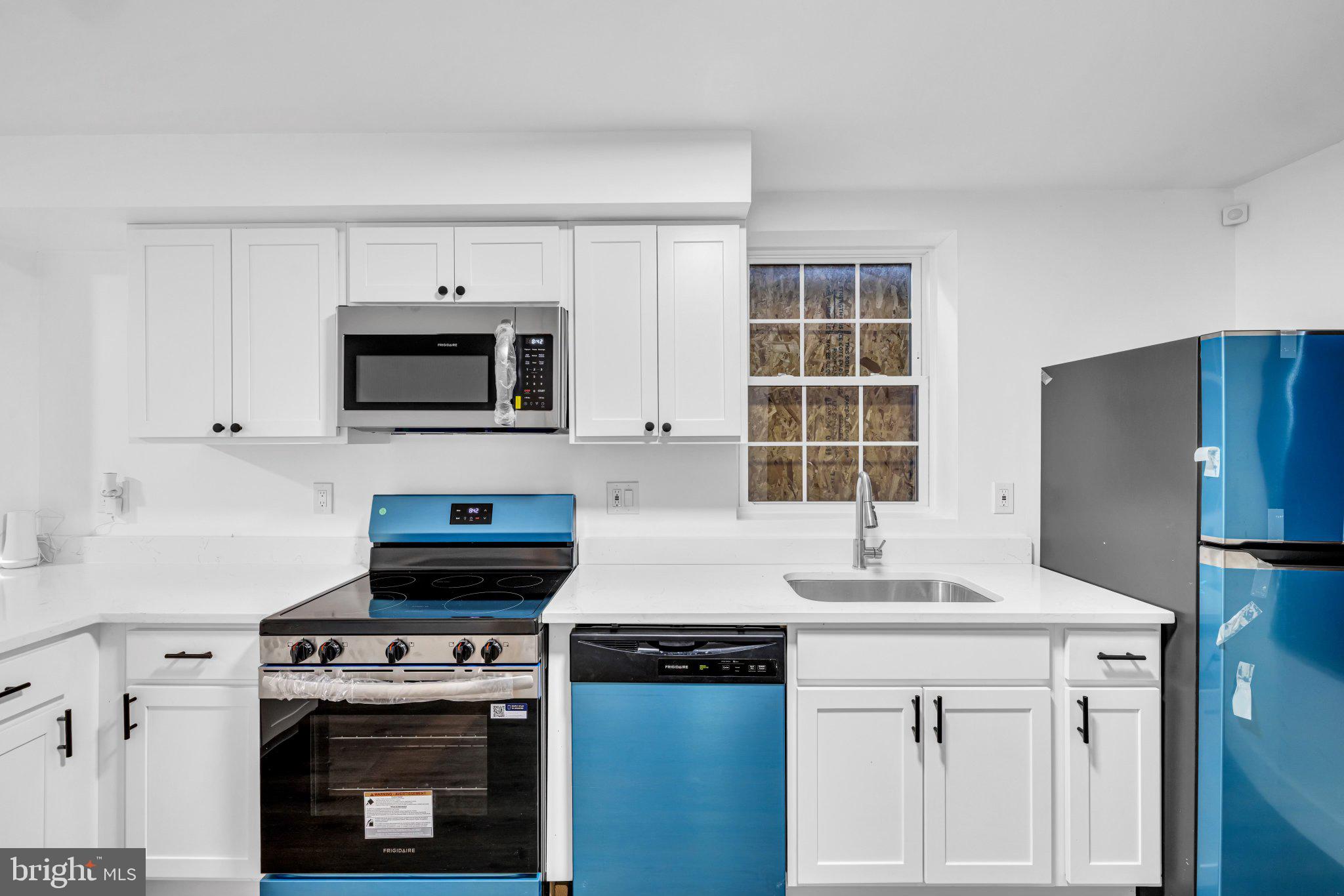 2801 Round Road Baltimore, MD 21225 - Photo 5 of 29 a kitchen with cabinets appliances a sink and a window