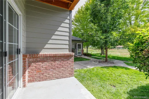 a view of a pathway of a house with a garden