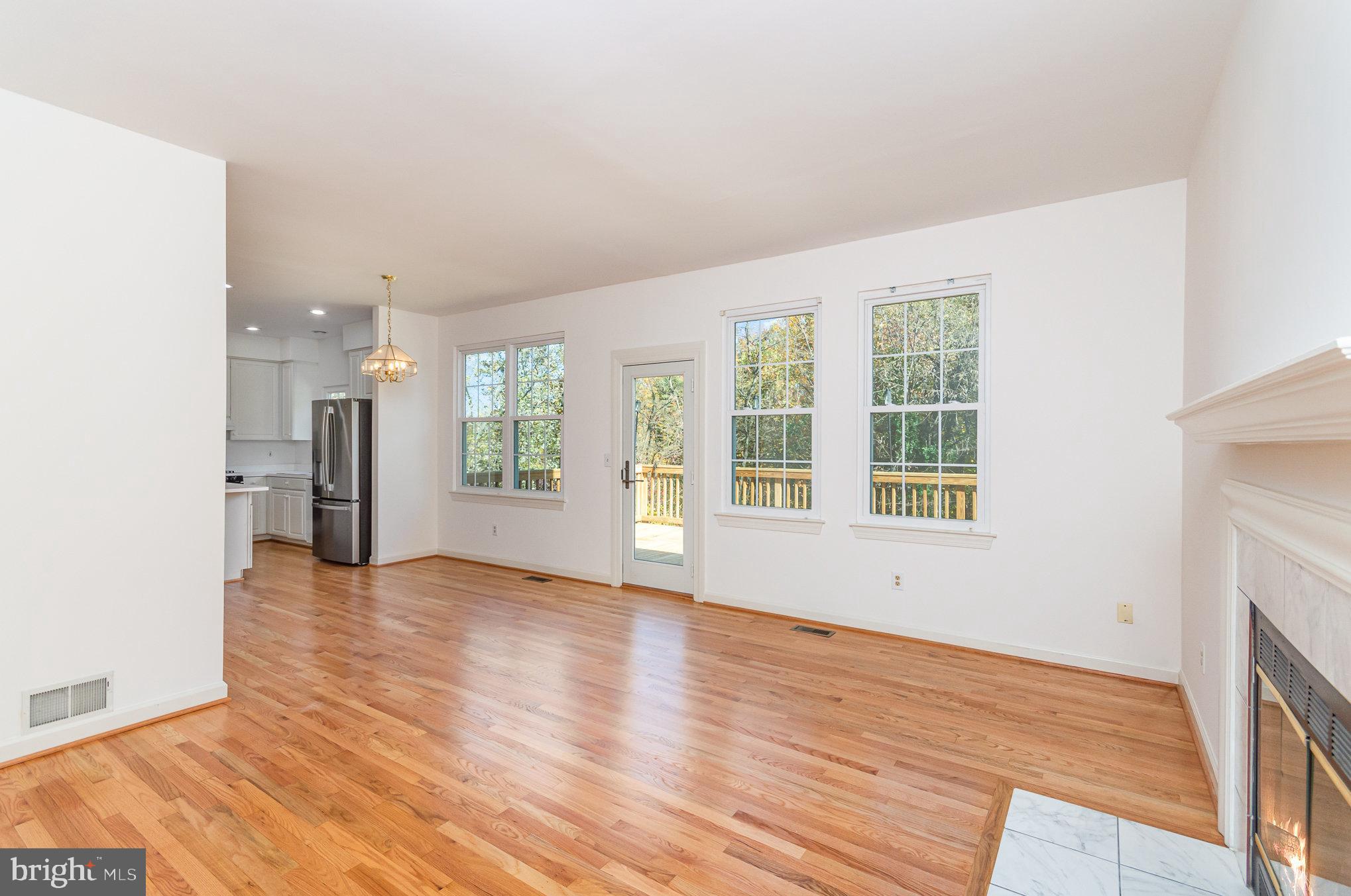 16033 Kings Mountain Road Woodbridge, VA 22191 - Photo 19 of 46 Family room looking into kitchen and back deck