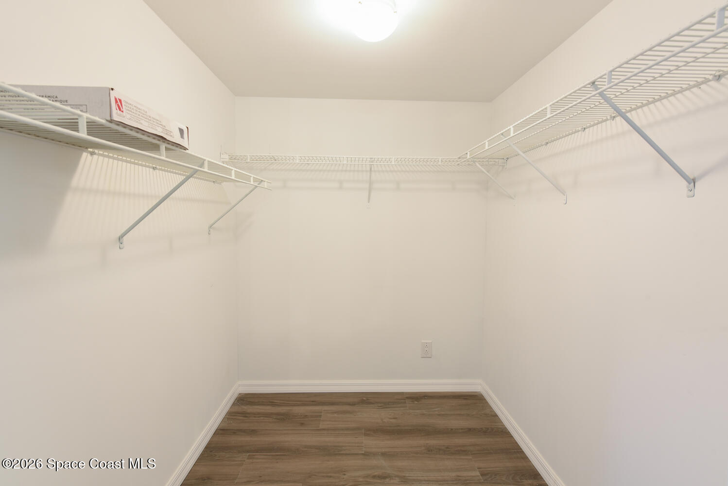 3100 Southeast Pruitt Road, Unit 104 Port St. Lucie, FL 34952 - Photo 21 of 32 a view of a room with racks on the wall