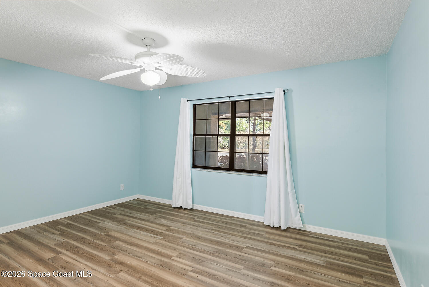 3100 Southeast Pruitt Road, Unit 104 Port St. Lucie, FL 34952 - Photo 24 of 32 a view of an empty room with a window