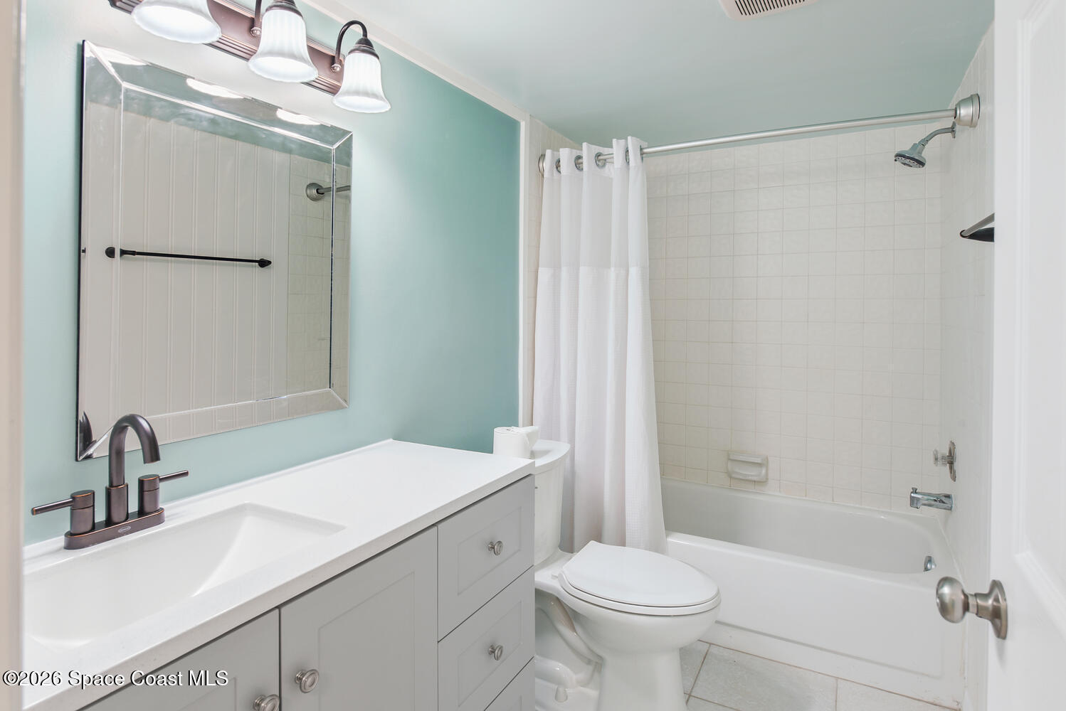 3100 Southeast Pruitt Road, Unit 104 Port St. Lucie, FL 34952 - Photo 25 of 32 a bathroom with a sink toilet and shower