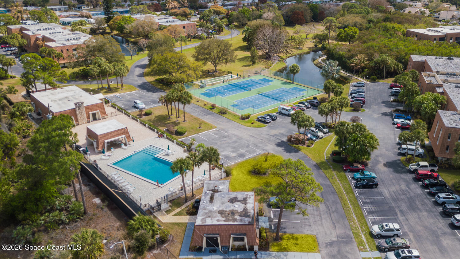 3100 Southeast Pruitt Road, Unit 104 Port St. Lucie, FL 34952 - Photo 27 of 32 an aerial view of residential houses with outdoor space