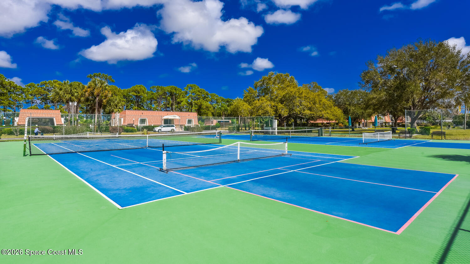 3100 Southeast Pruitt Road, Unit 104 Port St. Lucie, FL 34952 - Photo 28 of 32 a view of an outdoor space and basketball court