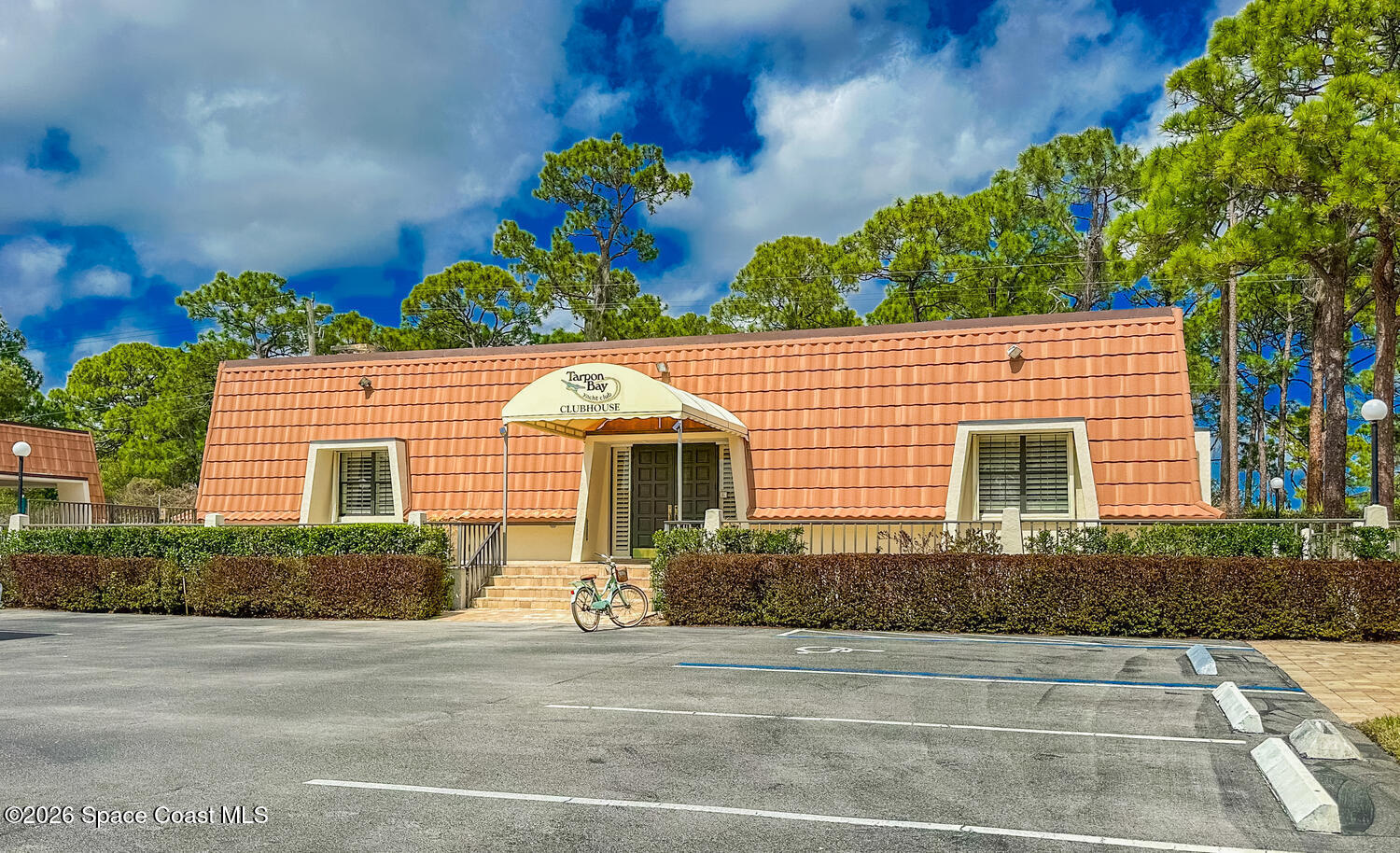 3100 Southeast Pruitt Road, Unit 104 Port St. Lucie, FL 34952 - Photo 31 of 32 a front view of a house with a yard