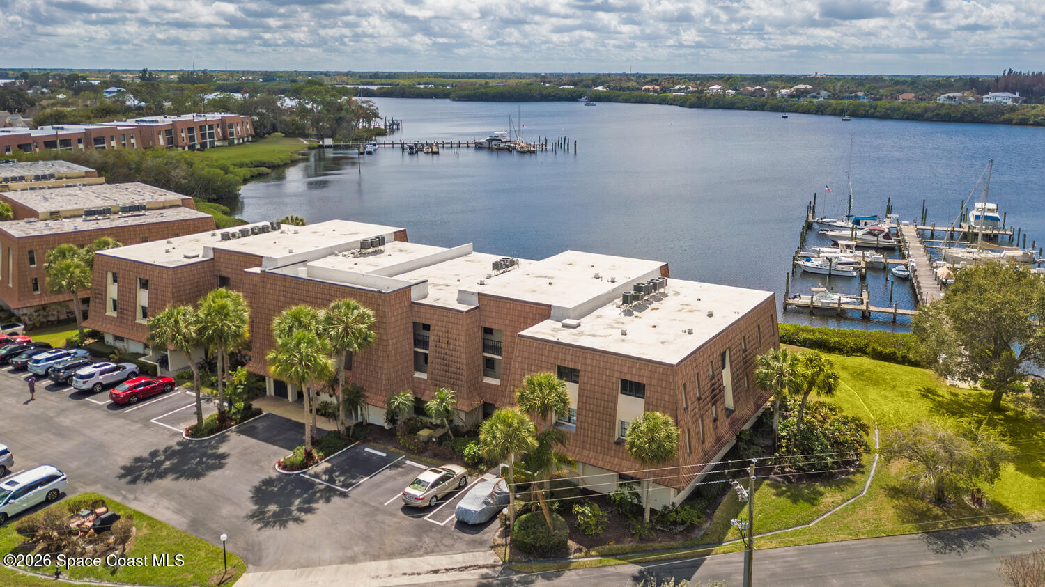 3100 Southeast Pruitt Road, Unit 104 Port St. Lucie, FL 34952 - Photo 4 of 32 an aerial view of a house with a lake view