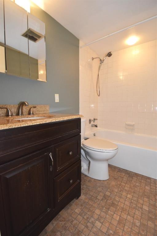 5 Bayard Road, Unit 306 Shadyside, PA 15213 - Photo 9 of 23 Updated bathroom with modern fixtures, a polished vanity, and a bright, easy-care tub and shower design.