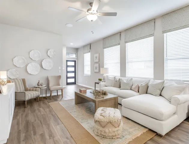 a kitchen with cabinets appliances a sink and a window