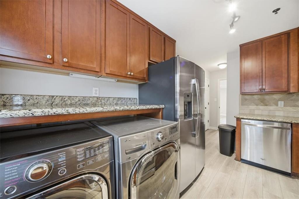 115 Winding River Drive, Unit B Atlanta, GA 30350 - Photo 12 of 32 a kitchen with a stove and a refrigerator