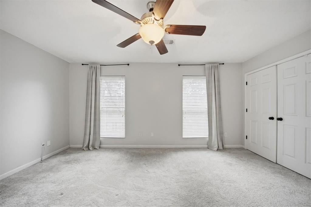 115 Winding River Drive, Unit B Atlanta, GA 30350 - Photo 17 of 32 a view of an empty room with a window