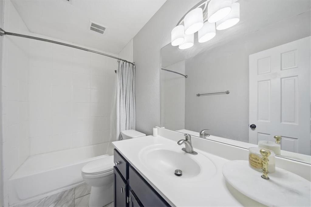 115 Winding River Drive, Unit B Atlanta, GA 30350 - Photo 20 of 32 a bathroom with a sink toilet and shower