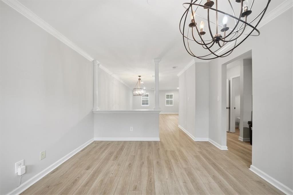 115 Winding River Drive, Unit B Atlanta, GA 30350 - Photo 6 of 32 a view of a hallway with wooden floor