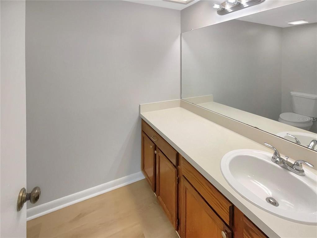 1003 Hammock Pine Boulevard, Unit 1003 Clearwater, FL 33761 - Photo 13 of 28 a bathroom with a sink and a mirror