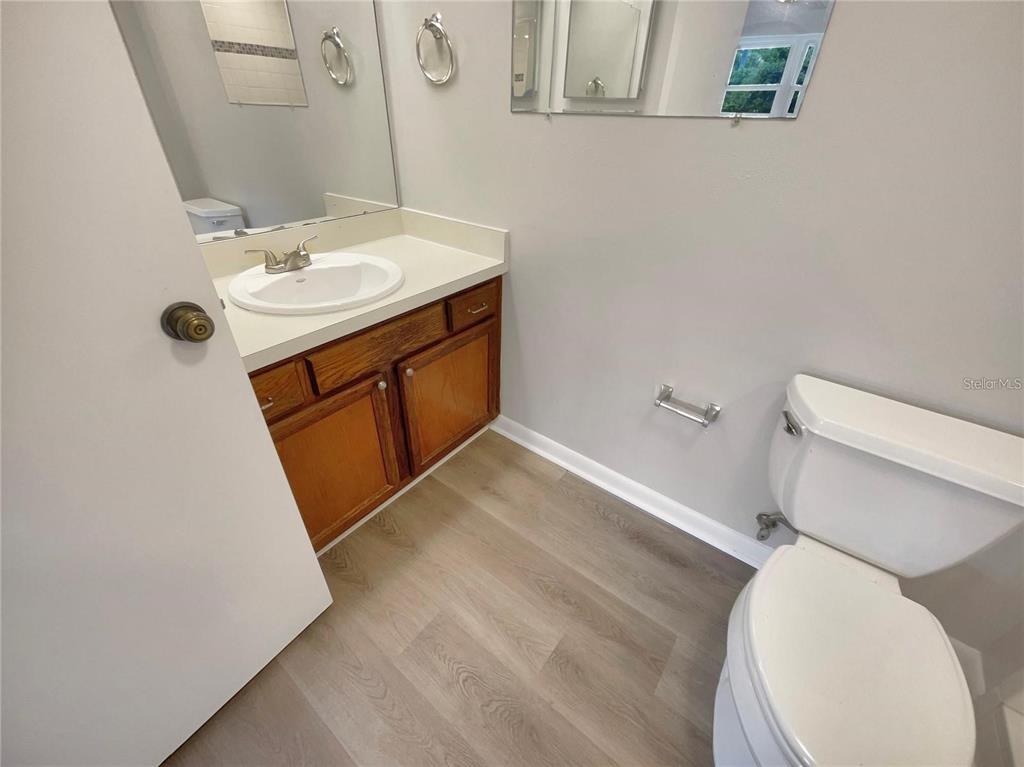1003 Hammock Pine Boulevard, Unit 1003 Clearwater, FL 33761 - Photo 16 of 28 a bathroom with a sink toilet and mirror