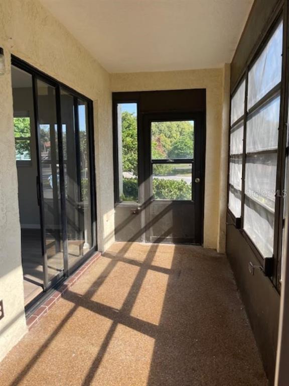 1003 Hammock Pine Boulevard, Unit 1003 Clearwater, FL 33761 - Photo 20 of 28 a view of hallway with a large window